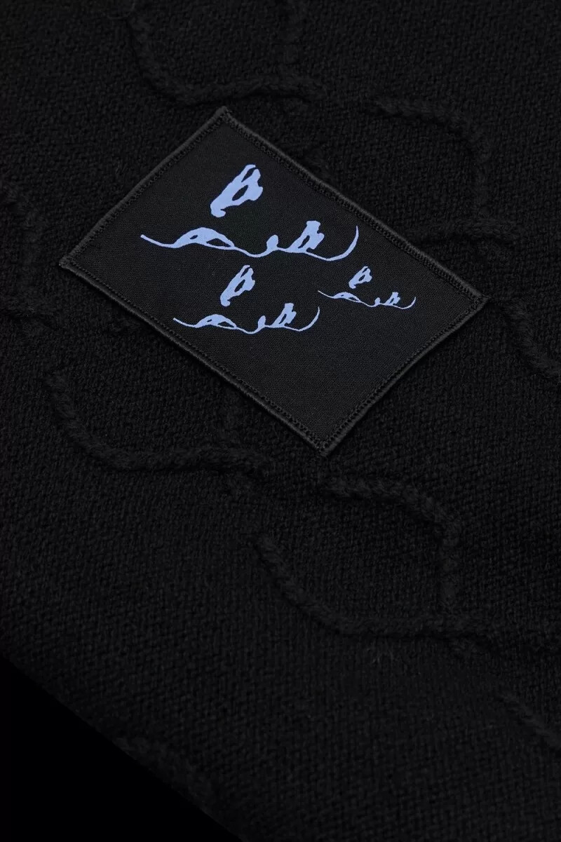 suéter extragrande fred perry con corona de laurel para hombre color negro